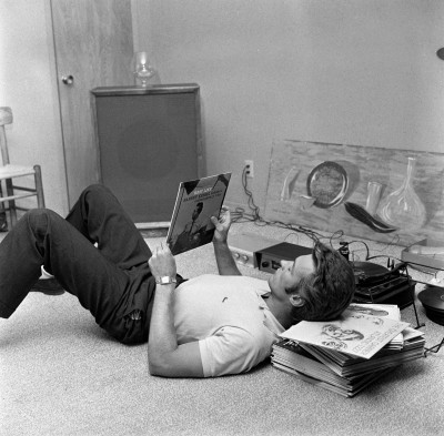 Clint Eastwood listening to his Jazz records at his home, October 1959.
