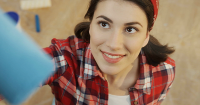 videoblocks-young-beautiful-woman-painting-camera-glass-in-a-blue-colour-with-a-big-brush-close-up-repair-in-the-apartment-indoor_h-gag67qm_thumbnail-full01.png